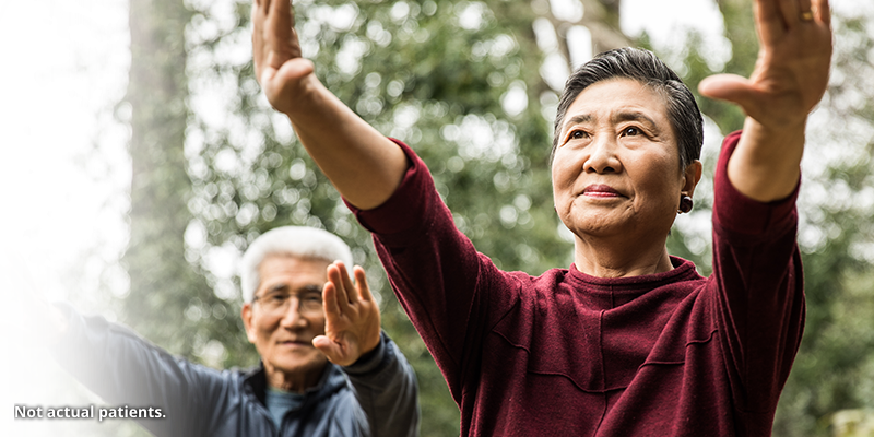 Elderly woman practicing yoga.