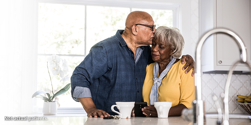 Man and woman embracing.